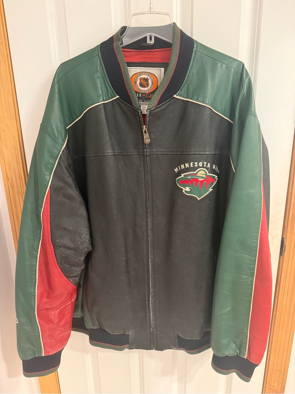 Well loved vintage NHL Minnesota Wild collarless Leather Bomber Jacket